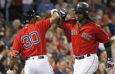 Boston Red Sox's Hanley Ramirez, right, celebrates his solo home run with Chris Young (30) during the fourth inning of a baseball game against the New York Yankees in Boston, Friday, Sept. 16, 2016. (AP Photo/Michael Dwyer)
